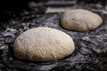Fototapeta na wymiar High hydration rye and wheat sourdough loaf shaped for an artisanal rustic wholegrain sourdough bread loaf, photo series