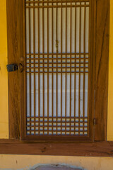 Wooden slatted and rice paper door