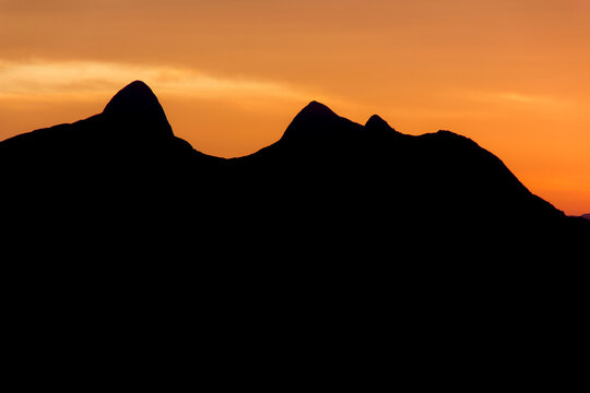 Silhouette of the mountain known as stone woman during sunrise in Teresopolis.
