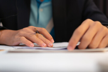 Businessman Manager take notes or signing documents reports papers on paper files in meeting room, modern blur light background, Document report or business management concept