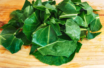 organic chard leaves chopped on on wooden background