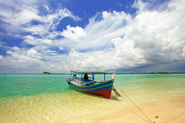Naklejka na ściany i meble Colorful boats and sandy beaches in Belitung, Indonesia.