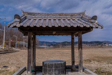 Covered water well in park