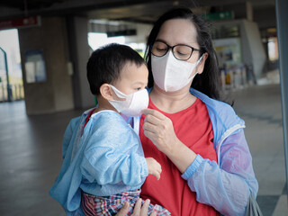 Asian child wearing white face mask to prevent Coronavirus