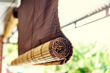 A photo focusing on bamboo blinds.
