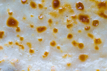 Abstract background of fried pancake closeup. Very appetizing