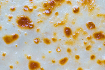 Abstract background of fried pancake closeup. Very appetizing