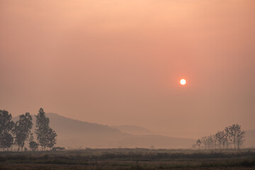 he sun is rising in the morning in the north of Thailand.
