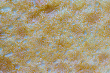 Abstract background of fried pancake closeup. Very appetizing
