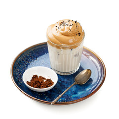 Dalgona coffee or whipped instant coffee. New popular food and drink trend, isolated on white background.