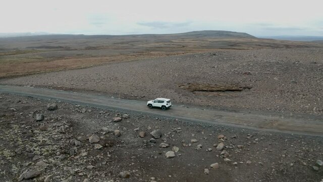 Rotating Arial Shot Of Car Driving Offroad