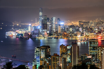 Awesome night aerial view of Victoria Harbor and Hong Kong