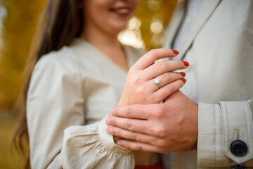Wedding ring on a girl’s finger. Engagement.