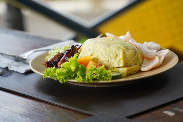 Yogyakarta's special food is fried rice wrapped in an omelette, added with beef and vegetables