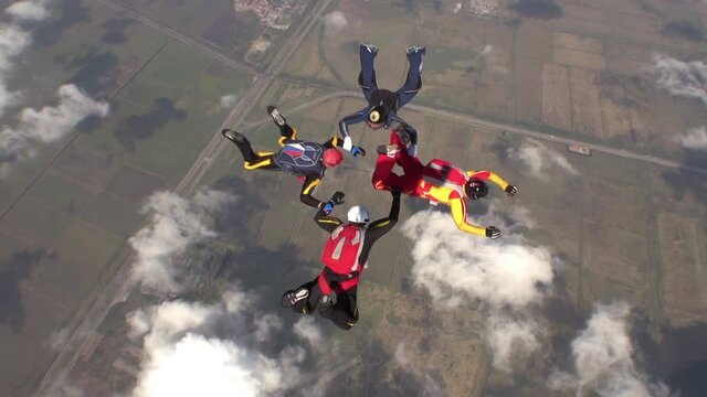 Sports parachutist build a figure in free fall. Extreme sport concept.