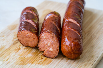 Bratwurst Sausage Filled with Emmental Cheese in Breakfast Plate.