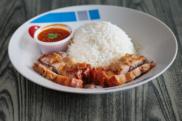 Three layers of crispy pork with rice.