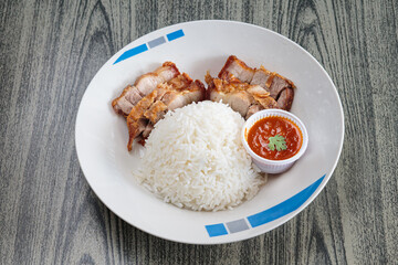 Three layers of crispy pork with rice.