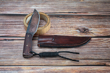 Dangerous and beautiful fighting knife with leather case.