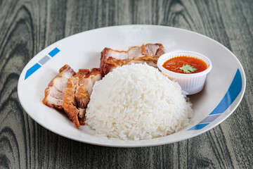 Three layers of crispy pork with rice.