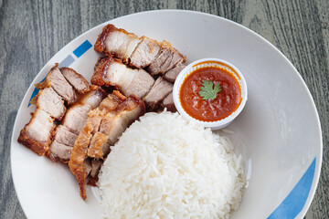 Three layers of crispy pork with rice.