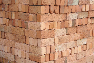 Pile of red clay brick at the construction site. 