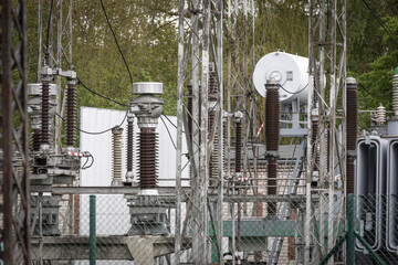 high-voltage wires and insulators in a modern substation. Isolation and circuit breaker in a power...