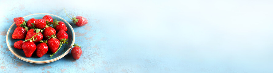 fresh strawberries on a plate on the background. Place for text. Copy Space.  banner