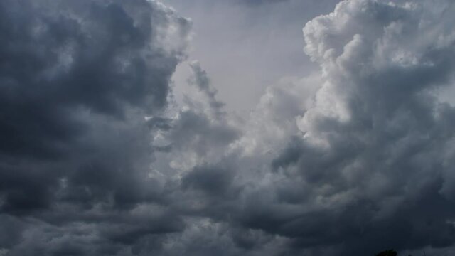 An angry sky, heavy, thunderclouds move quickly before a storm, a hurricane, a natural disaster. Dark, fast moving clouds, evil scene, darkness is approaching