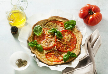 summer vegan pie galette with tomatoes and tofu in oat milk. tasty snack or healthy food lunch