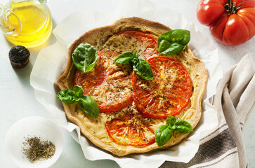 summer vegan pie galette with tomatoes and tofu in oat milk. tasty snack or healthy food lunch