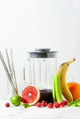 Empty glass smoothie blender bowl and ingredients on the table. Not disposable metal tubes. Healthly food.