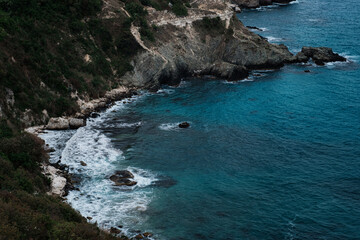 Picturesque seascape with rocky cliffs, stones, sea bay