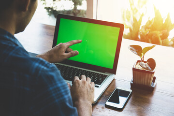 Business man working at office with laptop, close up of hands of business man.
