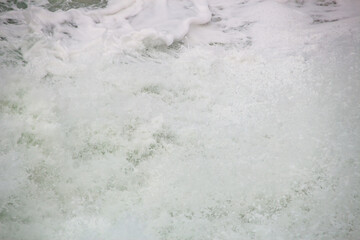 white foam of a wave at leblon beach in Rio de Janeiro.