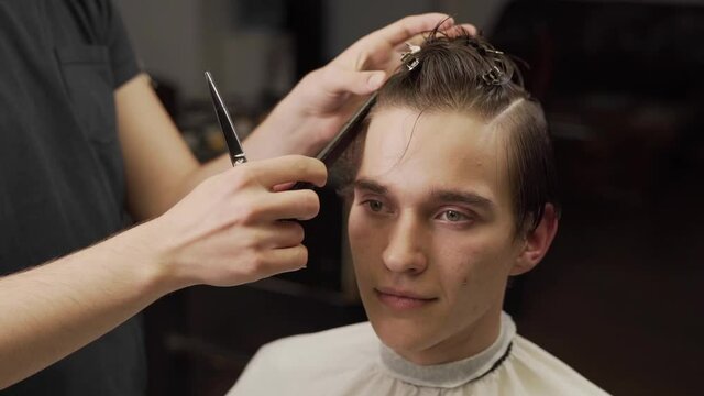 Men's long haircut in a barbershop