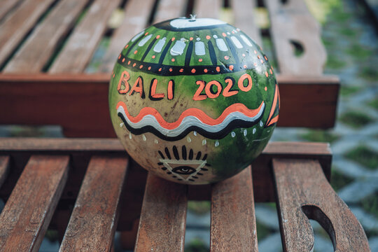 watermelon with the eye of providence symbol in a triangle and with the inscription bali 2020