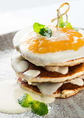 pancakes with banana and jam close-up
