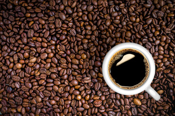 3d illustration black coffee over background with beans