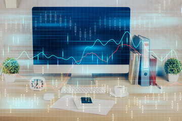 Forex graph hologram on table with computer background. Double exposure. Concept of financial markets.