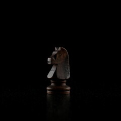 black chess piece on a black background