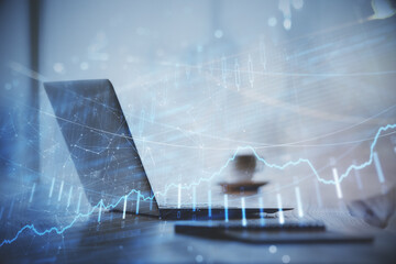 Double exposure of graph and financial info and work space with computer background. Concept of...