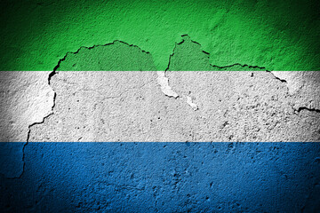 Sierra Leone flag on cracked wall