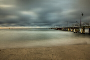 Fototapeta na wymiar Stormy sunrise over the baltic sea in Gdynia Orlowo, Poland