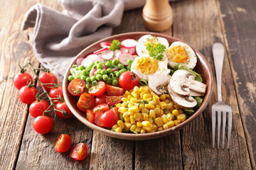 buddha bowl- vegetable salad with egg, mushroom, corn and tomato