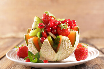 fresh fruit salad in melon bowl