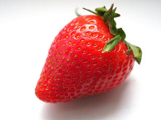 Large strawberry berry on a white background
