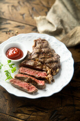 Grilled beef steak with tomato sauce