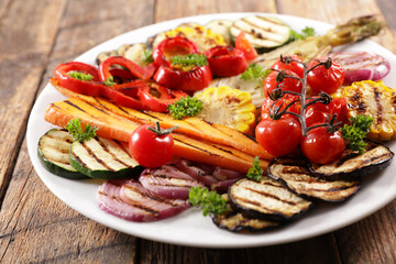 grilled colorful vegetable, bell pepper, zucchini, onion, tomato, carrot and dip sauce