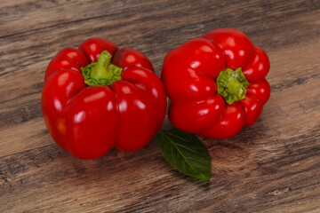 Ripe Red bell pepper over wooden